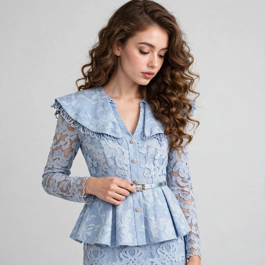 Close-up of a light blue lace blouse with a ruffled collar, button front, and peplum waist worn by a woman.