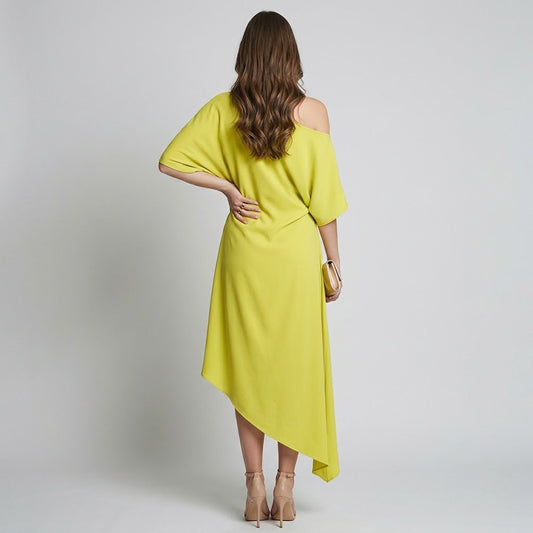 Back view of a woman wearing a bright yellow one-shoulder midi dress with draped skirt, short sleeve and asymmetrical hem.