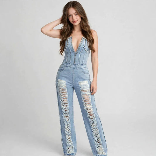 Distressed denim jumpsuit on model, styled studio pose