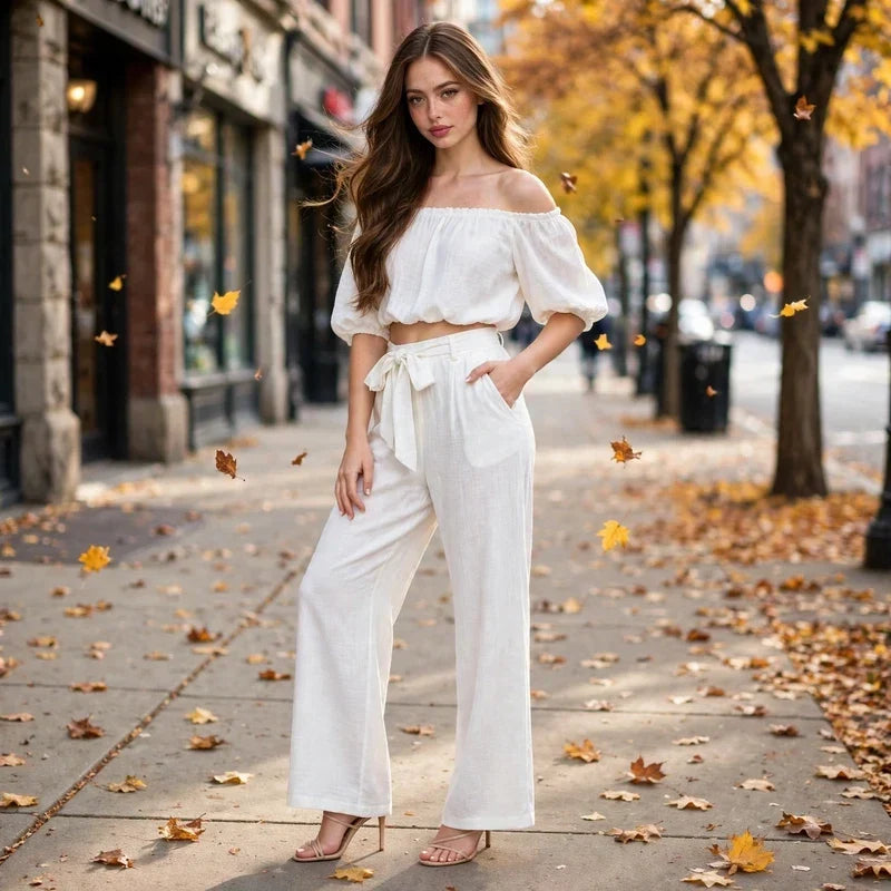 White off-shoulder matching set styled for fall on a city street