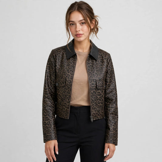 Woman in a brown leopard-print cropped faux leather jacket with black collar and utility pockets, black pants, gray studio.