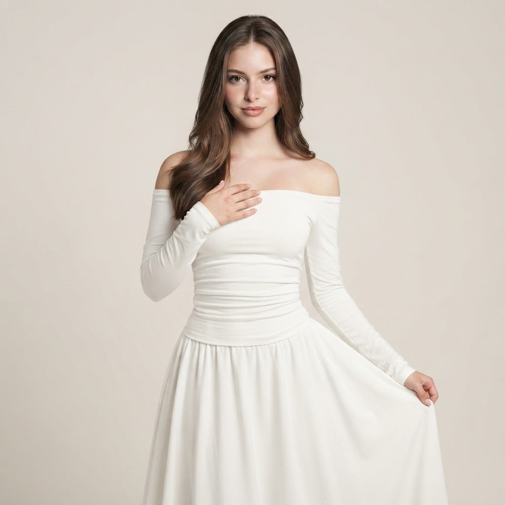 Woman in a solid white off-the-shoulder long-sleeve maxi dress with ruched bodice and flowing skirt, beige studio background.