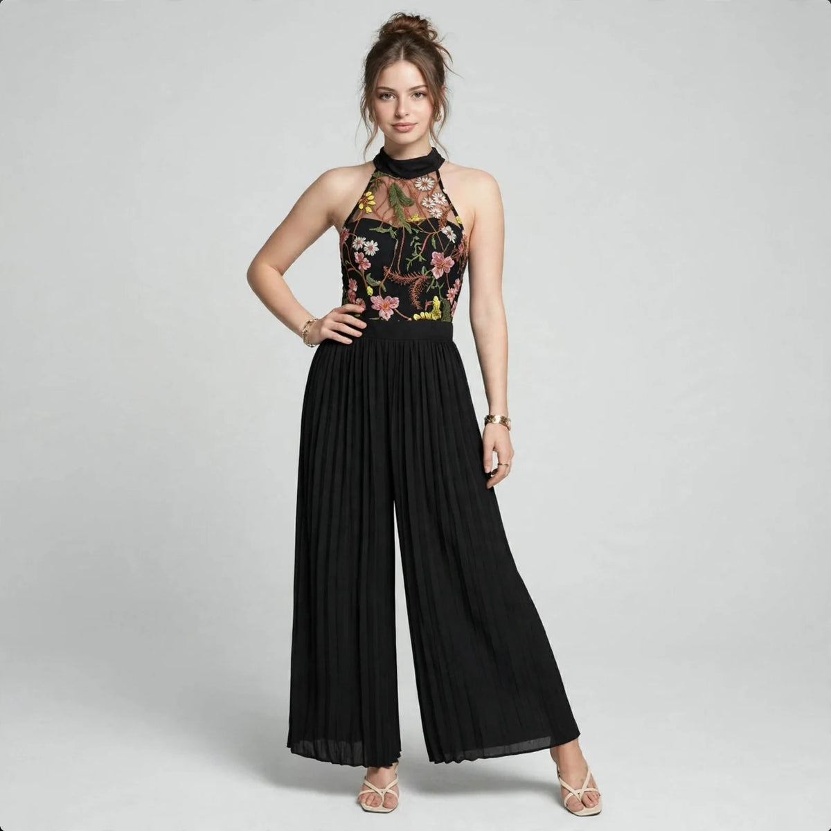 Floral halter jumpsuit on model, front view