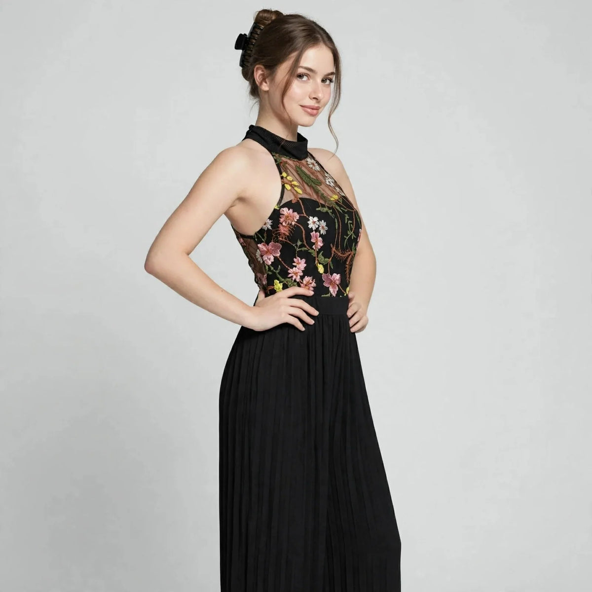 Floral halter jumpsuit on model, full-length view