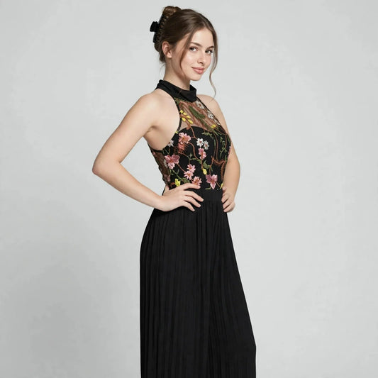 Floral halter jumpsuit on model, full-length view
