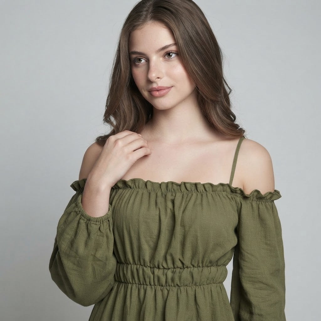 Close-up of olive green off-shoulder dress with ruffled elastic neckline, thin straps, and balloon sleeves.