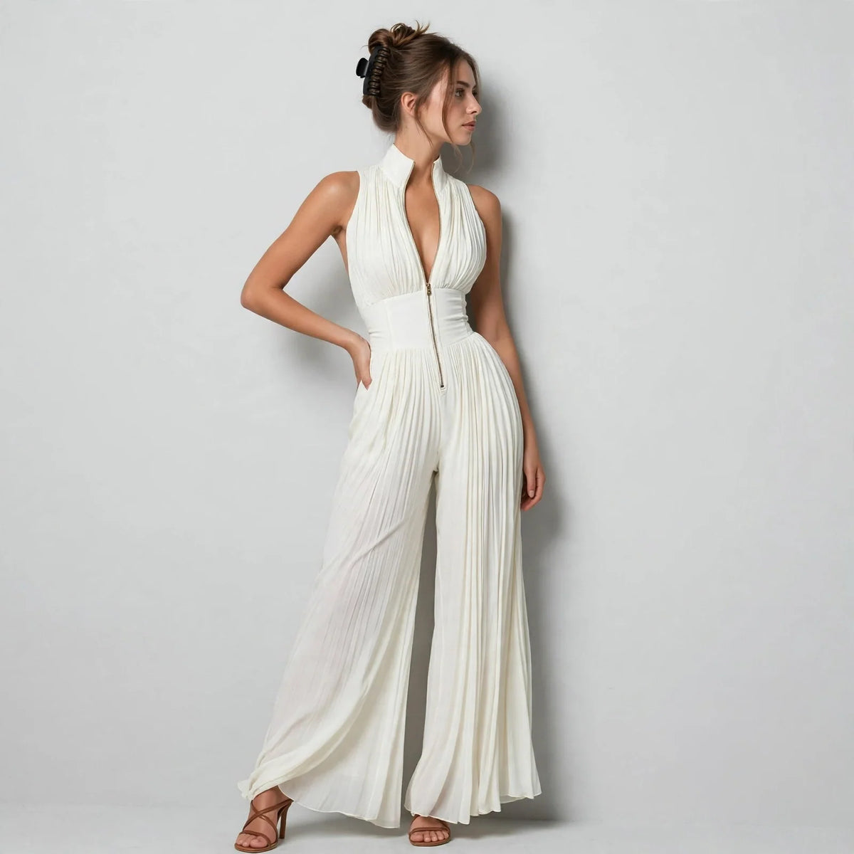 Cream pleated front-zip jumpsuit on model, styled studio pose