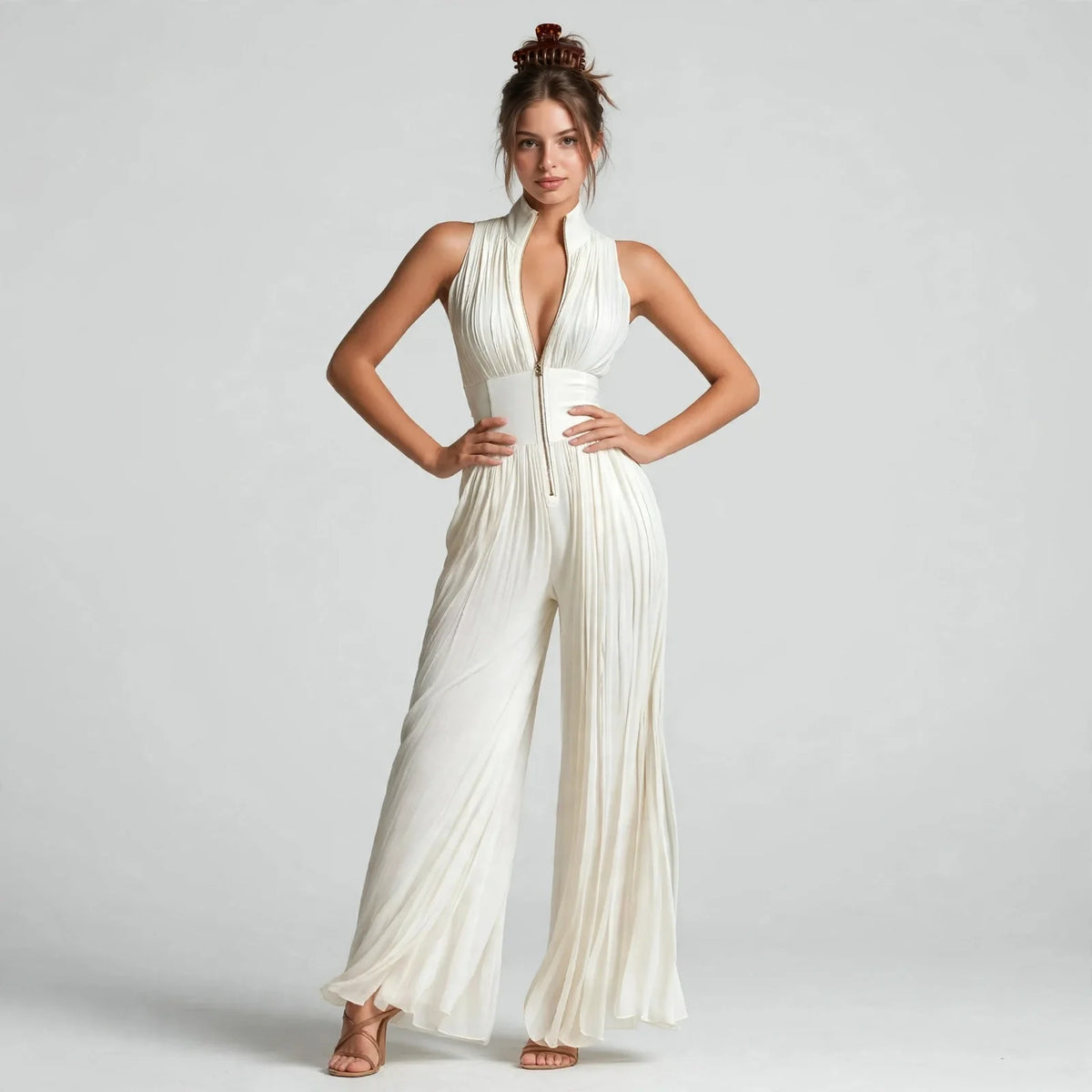 Cream pleated front-zip jumpsuit on model, alternate angle