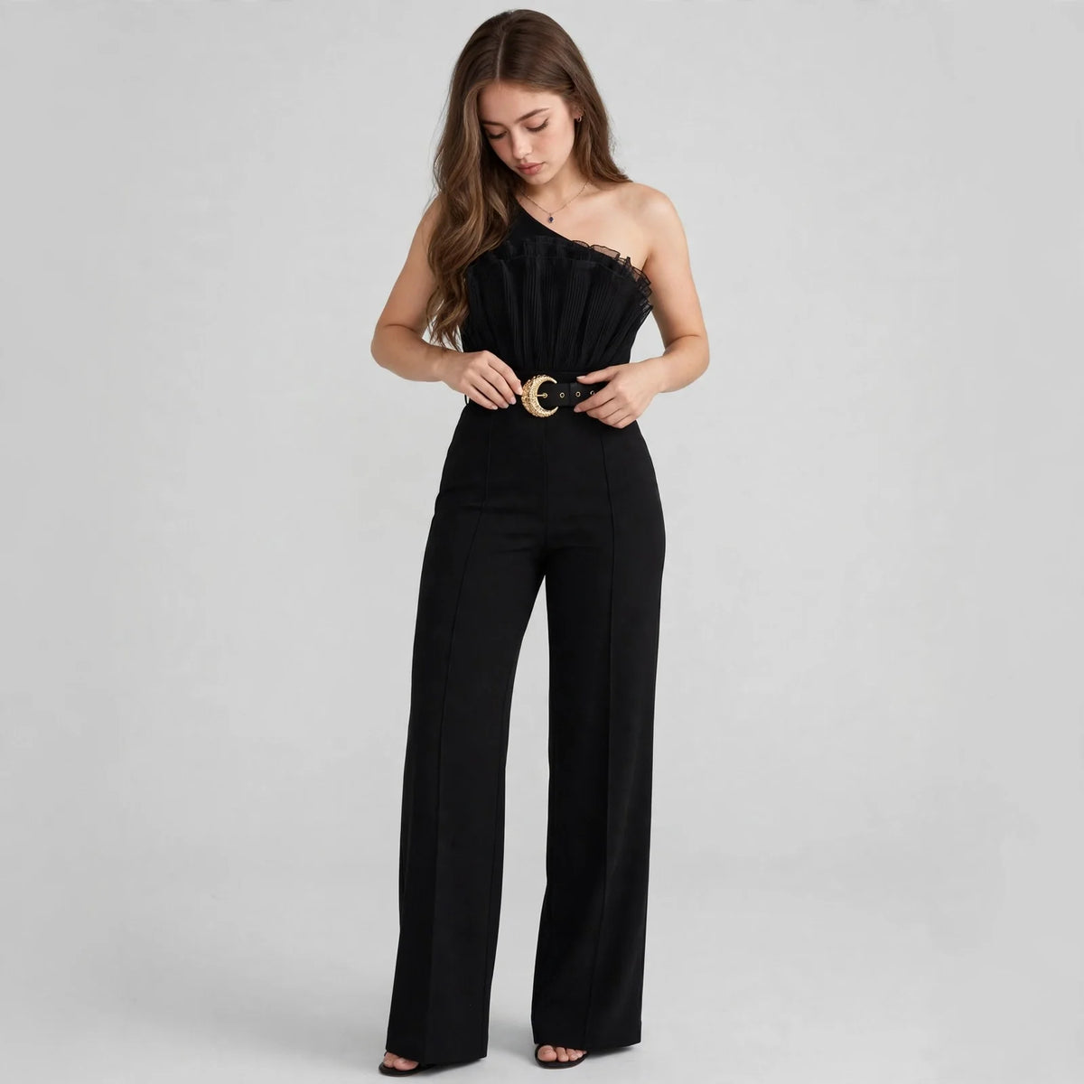 One-shoulder ruffle jumpsuit on model, full-length view