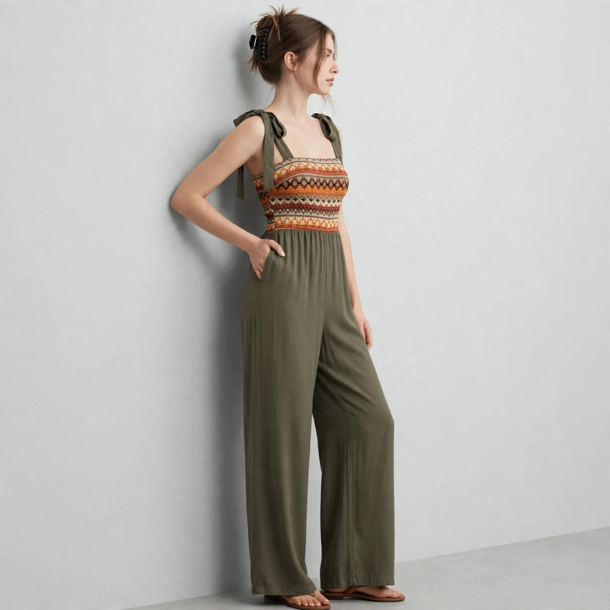 Tie-shoulder wide-leg jumpsuit on model, styled studio pose