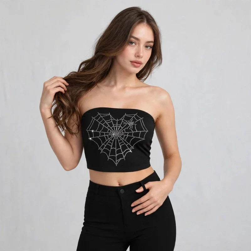 Black spider-web graphic tube top on model, styled studio pose
