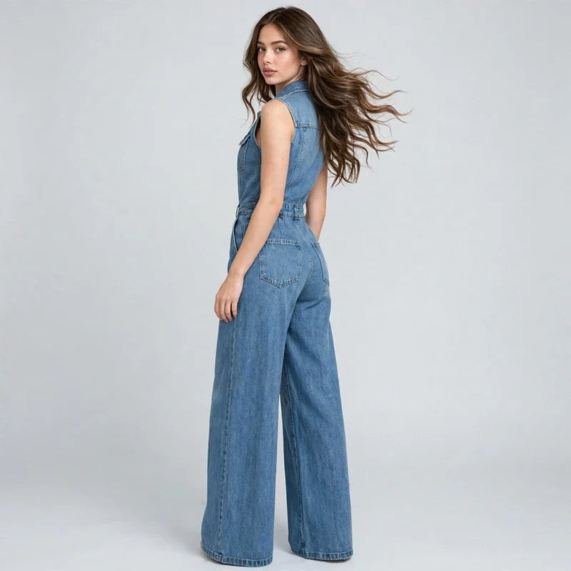 Denim button-front jumpsuit on model, styled studio pose